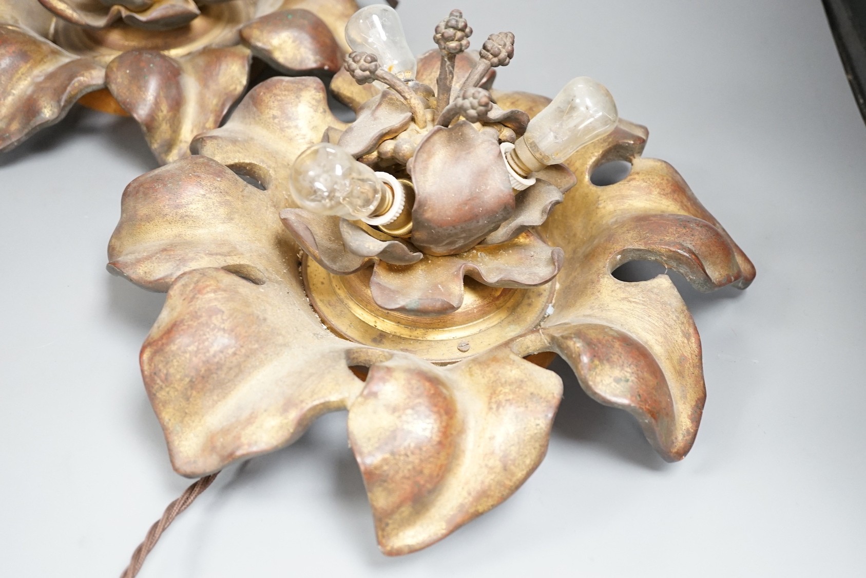 A pair of early 20th century gilt bronze flower head lights, 32cm, Will sit flat on a table possibly once ceiling mounted